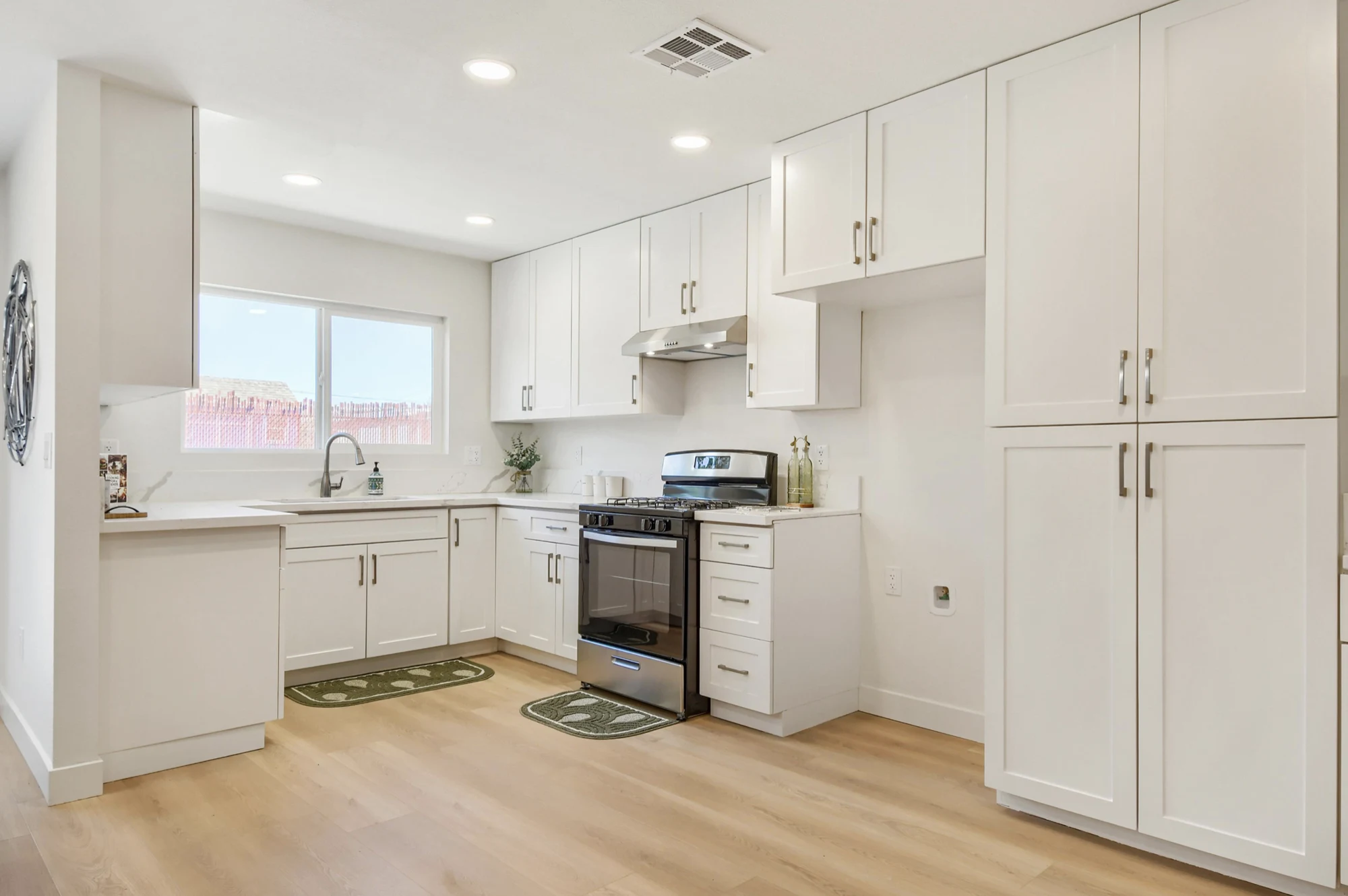 White kitchen cabinetry and stainless steel appliances
